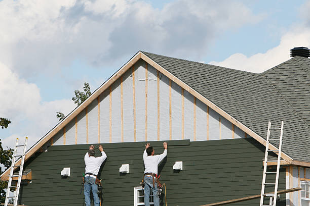 Professional Siding technician working in East Islip, NY